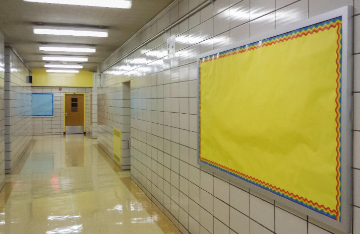 Blank music bulletin board in elementary school hallway